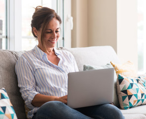 Photo Of Doctor Who Has Learned That She Can Complete Online Chiropractic Continuing Education Credits At Home On Her Laptop